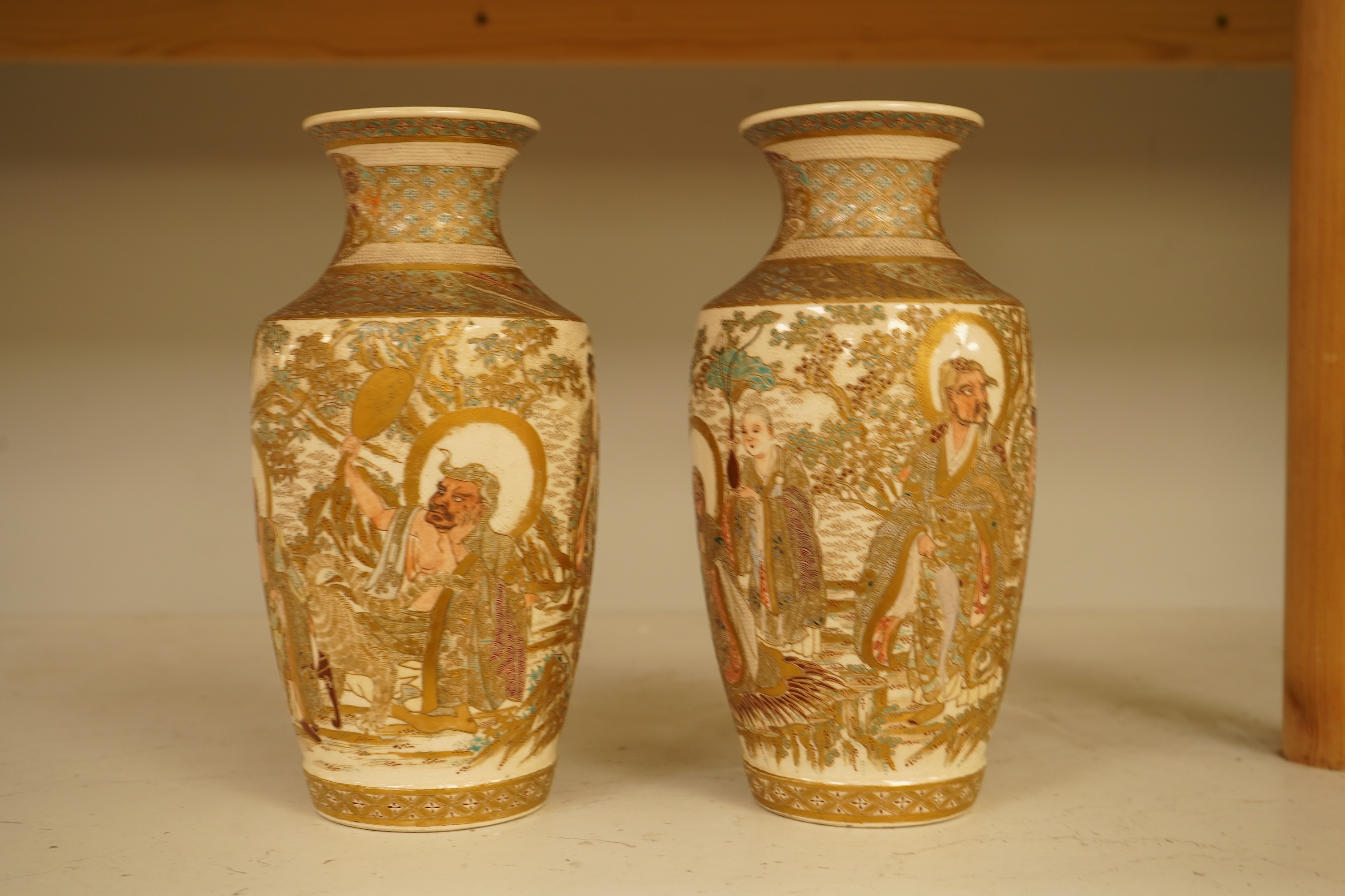 A pair of Japanese Satsuma ‘rakan’ vases, Meiji period, 21cm